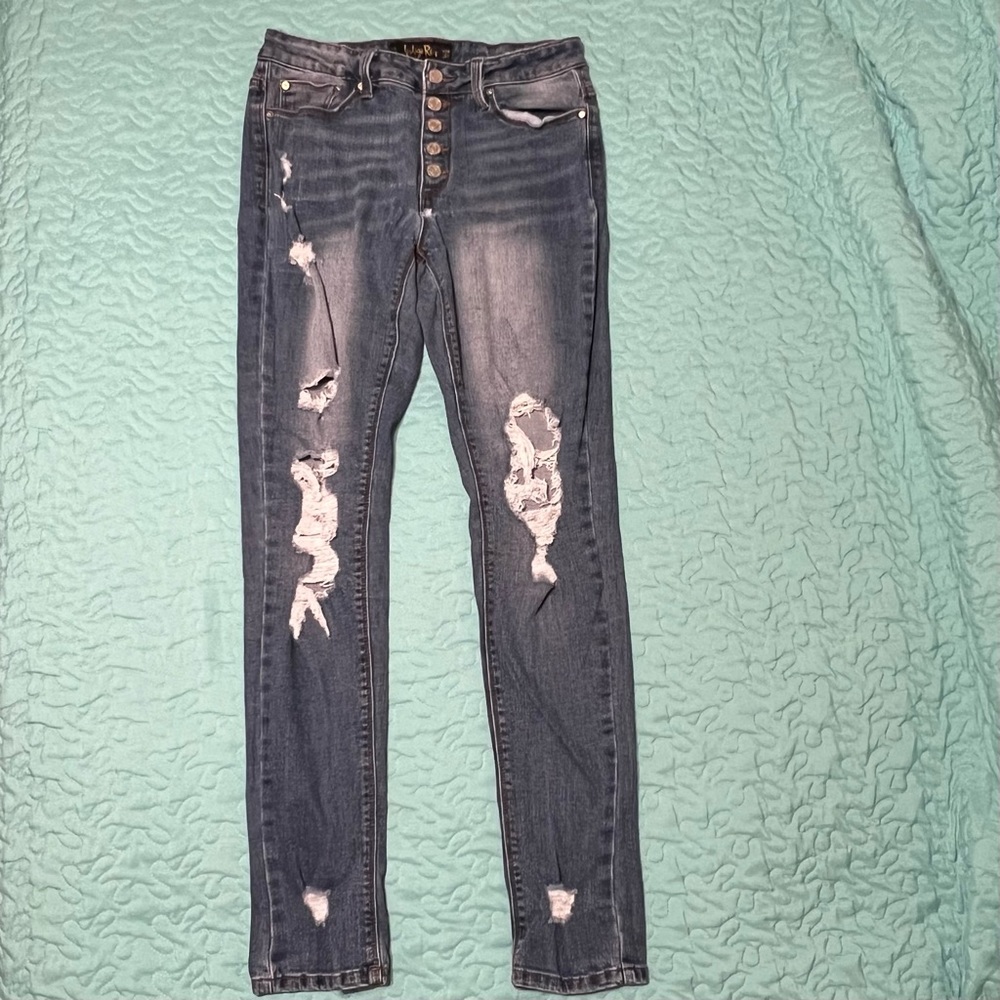 Indigo Rein distressed jeans with button fly. Size 9.